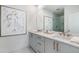 Beautiful bathroom featuring double vanity, modern art, and glass enclosed shower at 515 Motivation Nw Cir, Atlanta, GA 30309