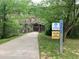 Picturesque Beltline trail surrounded by lush greenery and a rustic wooden bridge at 515 Motivation Nw Cir, Atlanta, GA 30309