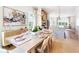 Elegant dining area with natural light, hardwood floors, and stylish decor, adjoining the kitchen at 515 Motivation Nw Cir, Atlanta, GA 30309