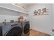 Well-equipped laundry room featuring modern washer and dryer and plenty of storage space at 515 Motivation Nw Cir, Atlanta, GA 30309