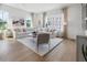 Inviting living room featuring lots of natural light, hardwood floors, and stylish modern decor at 515 Motivation Nw Cir, Atlanta, GA 30309