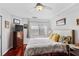 Bright bedroom with a ceiling fan, hardwood floors and a comfortable bed at 1501 Clairmont Rd # 1522, Decatur, GA 30033