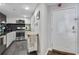 View of kitchen leading to the front door featuring stainless steel appliances at 1501 Clairmont Rd # 1522, Decatur, GA 30033