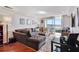 Comfortable living room with a tufted couch and sliding glass doors leading to a balcony at 1501 Clairmont Rd # 1522, Decatur, GA 30033