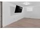 Basement room has a sleek, wall-mounted television and neutral flooring, ready for customization at 2210 Polar Rock Sw Ave, Atlanta, GA 30315