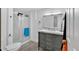 Bathroom features a new vanity with marble countertops and a shower with a glass door at 2210 Polar Rock Sw Ave, Atlanta, GA 30315