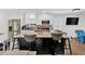 Bright kitchen with a black island, stainless steel appliances, and ample cabinet space at 2210 Polar Rock Sw Ave, Atlanta, GA 30315