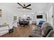 Spacious living room with hardwood floors, modern lighting, and an open floor plan at 2210 Polar Rock Sw Ave, Atlanta, GA 30315