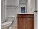 This is a half bathroom with a white toilet, a vanity with a brown cabinet at 3128 Onamia Rd, Duluth, GA 30096