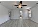 Bedroom features hardwood floors and a ceiling fan at 3128 Onamia Rd, Duluth, GA 30096