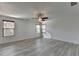 Large bedroom with ceiling fan and multiple windows providing natural light at 3128 Onamia Rd, Duluth, GA 30096