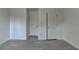 An empty bedroom featuring hardwood floors and a bright white paint at 3128 Onamia Rd, Duluth, GA 30096