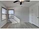 Bright bedroom with ceiling fan, hard surface flooring, two windows, and ample closet space at 3128 Onamia Rd, Duluth, GA 30096