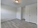 An empty bedroom featuring hardwood floors and a bright white paint at 3128 Onamia Rd, Duluth, GA 30096