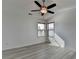Sunlit bedroom with modern ceiling fan and hard surface flooring and two large windows at 3128 Onamia Rd, Duluth, GA 30096