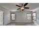 Bright bedroom with two windows and ceiling fan at 3128 Onamia Rd, Duluth, GA 30096