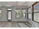Dining area with wood floors, modern lighting, and lots of natural light at 3128 Onamia Rd, Duluth, GA 30096