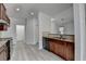 Well-lit kitchen with granite counters, wood cabinets, and stainless steel appliances at 3128 Onamia Rd, Duluth, GA 30096