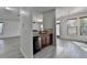 Kitchen with stainless steel dishwasher and sink, granite countertops, and open layout to other living areas at 3128 Onamia Rd, Duluth, GA 30096