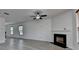 Living room with fireplace, neutral walls and wood flooring at 3128 Onamia Rd, Duluth, GA 30096