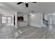 Open-concept living area featuring hardwood flooring, stairs, and lots of natural light at 3128 Onamia Rd, Duluth, GA 30096