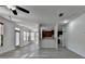 Open-concept living area with hardwood flooring, lots of windows, and modern ceiling fan at 3128 Onamia Rd, Duluth, GA 30096