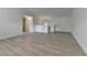 Bright living room features modern hard surface flooring and plenty of natural light at 3128 Onamia Rd, Duluth, GA 30096