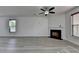 Living room featuring fireplace, neutral walls and wood flooring at 3128 Onamia Rd, Duluth, GA 30096