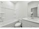 The bathroom includes a shower-tub, toilet, and a vanity with mirror for everyday needs at 6905 Winchester Pl, Fairburn, GA 30213