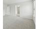 Bright bedroom with plush carpet and neutral walls, creating a serene and inviting space at 6905 Winchester Pl, Fairburn, GA 30213