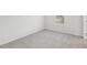 Light and airy bedroom with neutral carpet and a view from the window at 6905 Winchester Pl, Fairburn, GA 30213