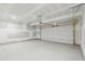 Spacious two car garage with smooth concrete flooring and garage door at 6905 Winchester Pl, Fairburn, GA 30213