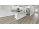 Modern kitchen with white cabinets, granite countertops, stainless steel appliances, and a central island at 6905 Winchester Pl, Fairburn, GA 30213