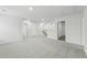 This large loft features neutral paint and carpet, recessed lighting, and provides ample space for Gathering activities at 6905 Winchester Pl, Fairburn, GA 30213