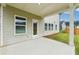 Back patio showcasing a large concrete patio area with a view of the backyard at 6905 Winchester Pl, Fairburn, GA 30213