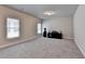 Large bonus room with neutral paint, carpet flooring, and windows providing natural light at 919 Olmsted Ln, Johns Creek, GA 30097