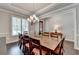 Bright dining room showcasing a large table, stylish chairs, and well-lit interiors at 919 Olmsted Ln, Johns Creek, GA 30097