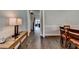 Light-filled space adjacent to the dining area, featuring hardwood floors and staircase at 919 Olmsted Ln, Johns Creek, GA 30097
