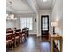 Elegant dining room with hardwood floors, decorative lighting, and stylish traditional décor at 919 Olmsted Ln, Johns Creek, GA 30097