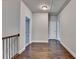 Hallway features hardwood floors, gray walls and white trim at 919 Olmsted Ln, Johns Creek, GA 30097