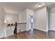 Hallway featuring hardwood floors, gray walls, and iron railing at 919 Olmsted Ln, Johns Creek, GA 30097