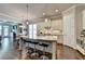Stylish kitchen featuring granite countertops, pendant lighting, stainless steel appliances, and hardwood floors at 919 Olmsted Ln, Johns Creek, GA 30097