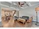 Open concept living room featuring a view of the kitchen and hardwood floors at 919 Olmsted Ln, Johns Creek, GA 30097