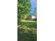 Spacious backyard with lush green lawn, perfect for outdoor activities and enjoying the natural surroundings at 144 Wiley Dr, Douglasville, GA 30134