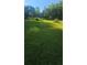 Large backyard with lush greenery, offering ample space for outdoor activities and recreation at 144 Wiley Dr, Douglasville, GA 30134