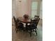 Inviting dining area with wood table and seating, complemented by natural light at 144 Wiley Dr, Douglasville, GA 30134