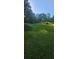 Serene land with a mix of green grass and trees, offering a peaceful retreat at 144 Wiley Dr, Douglasville, GA 30134