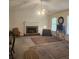 Cozy living room with fireplace, carpet, fan and natural light at 144 Wiley Dr, Douglasville, GA 30134