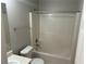 Bathroom with a shower-tub combo, toilet, and single sink vanity at 3702 Gray Birch Dr, Decatur, GA 30034