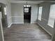 Dining room with hardwood floors, wainscoting, large windows, and chandelier at 3702 Gray Birch Dr, Decatur, GA 30034